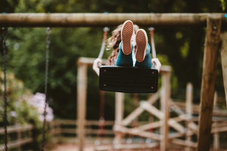a child on a playground swing